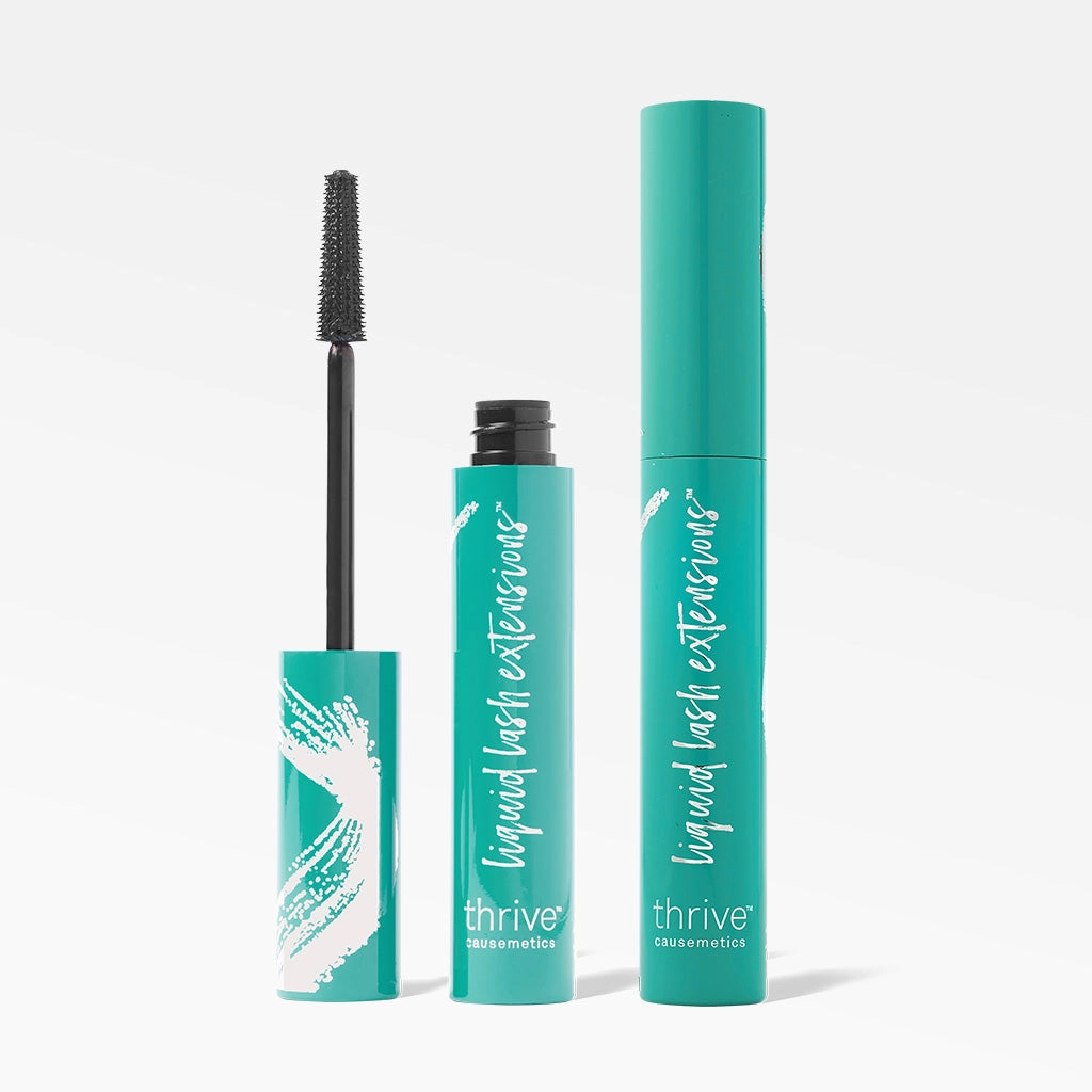 Two mascara tubes standing next to each other
